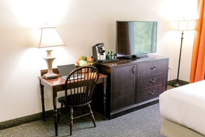 bed facing television and desk