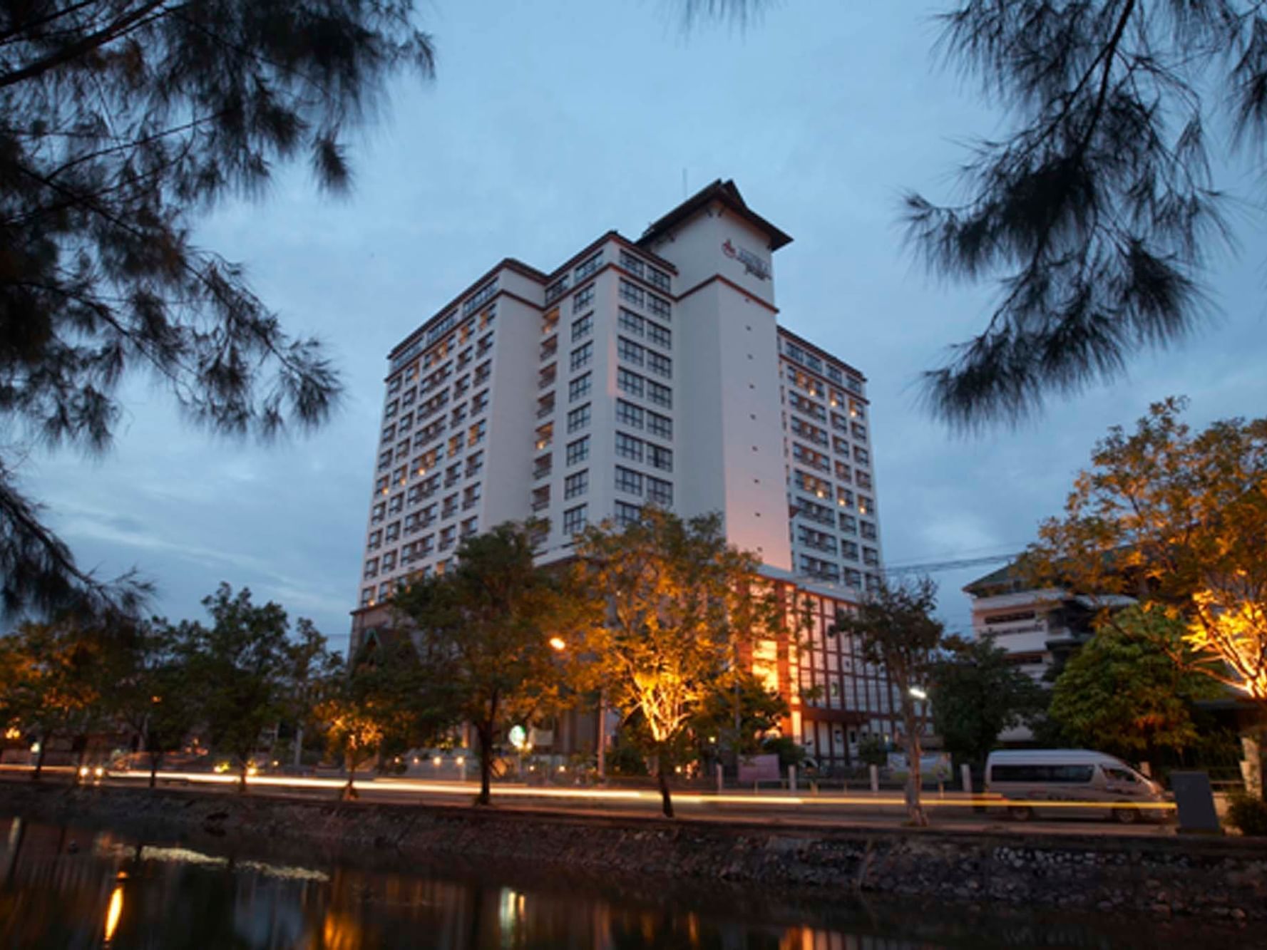 Exterior view of Amora Hotel Chiang Mai Building with road