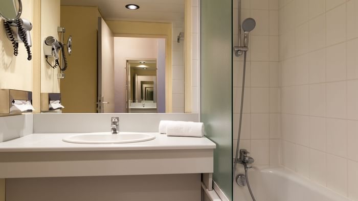 Bathroom vanity in bedrooms at Hotel Le Forum