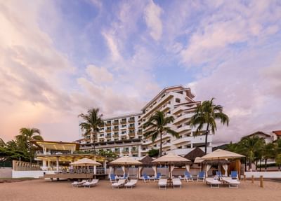 Exterior of Villa Premiere Boutique Hotel & Romantic Getaway by beach with loungers