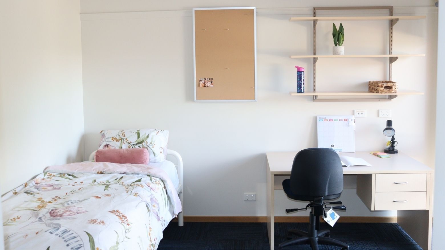 Neat bedroom with desk and bed at La Trobe University Terraces.