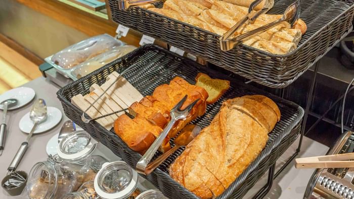 Variety of breads in the buffet trays at The Originals Hotels