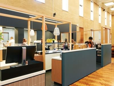 People in the lobby of La Trobe University - Glenn College.