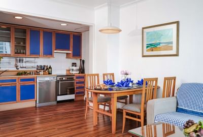 Living room with kitchen and wooden floor at Hanoi Daewoo Hotel