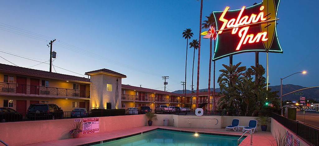 Coast Safari Inn pool with neon sign