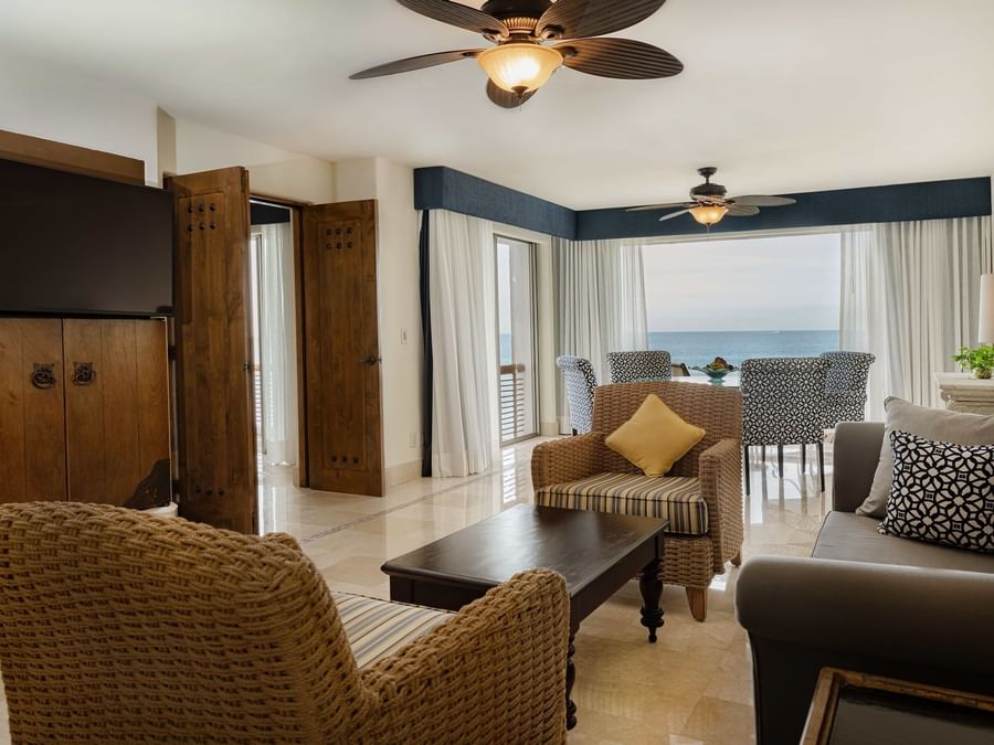Living area of Casita Ocean front at Marquis Los Cabos Resort featuring a Couch and a TV with a ocean view