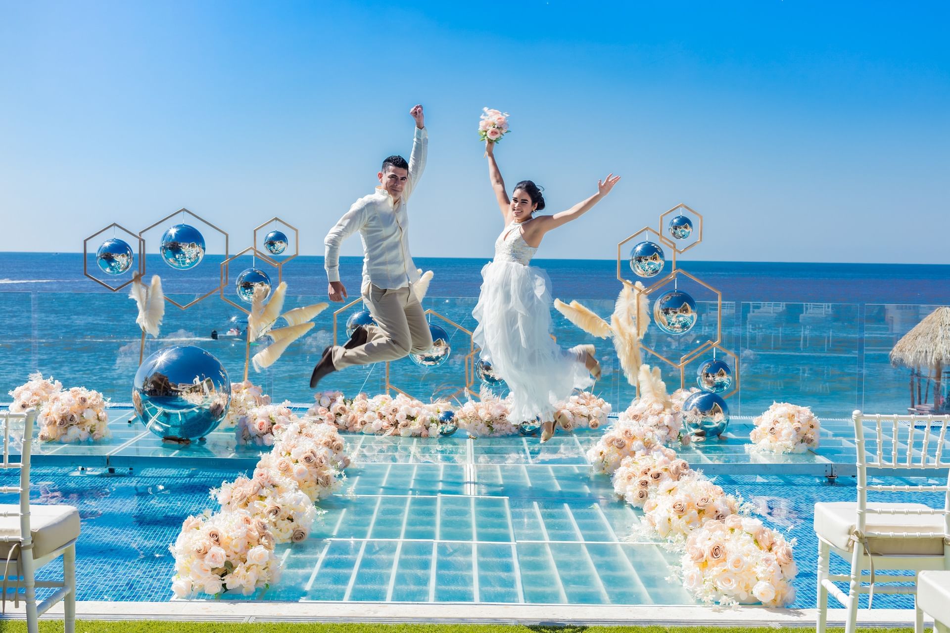Couple enjoying their wedding day at Playa Los Arcos