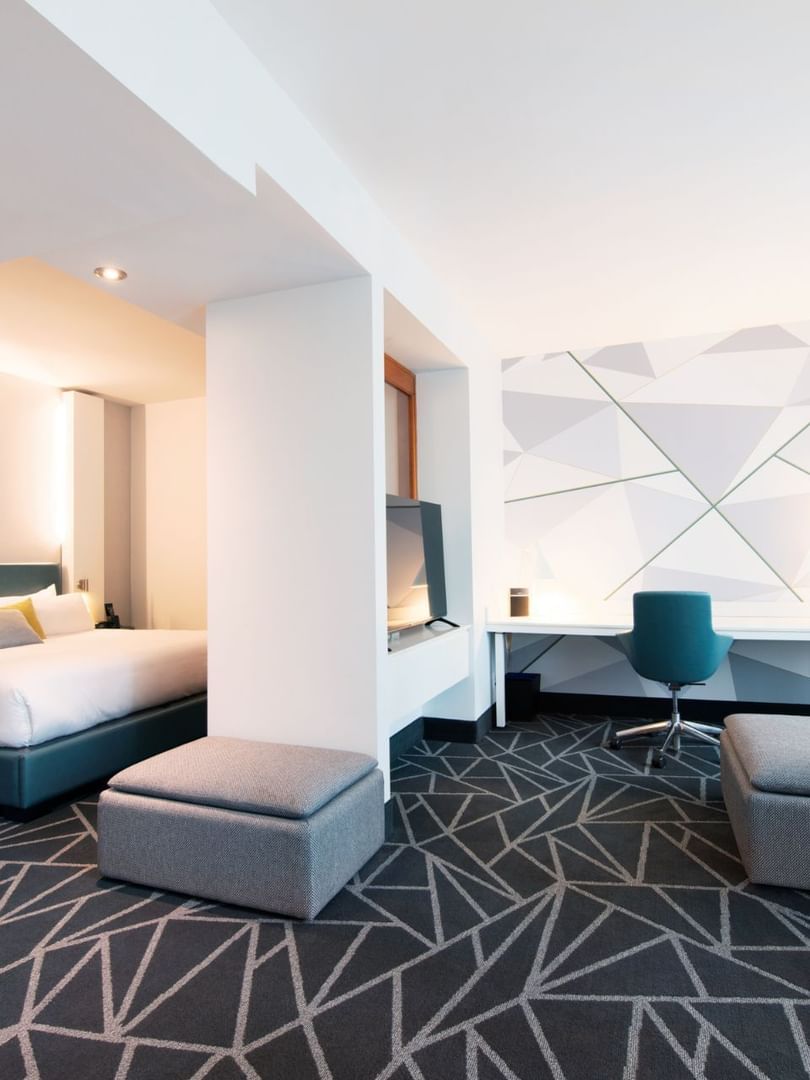 Separated bedroom and work area in Premium loft Suite at Warwick Le Crystal Montreal