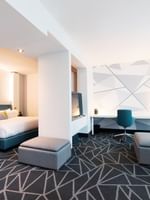 Separated bedroom and work area in Premium loft Suite at Warwick Le Crystal Montreal