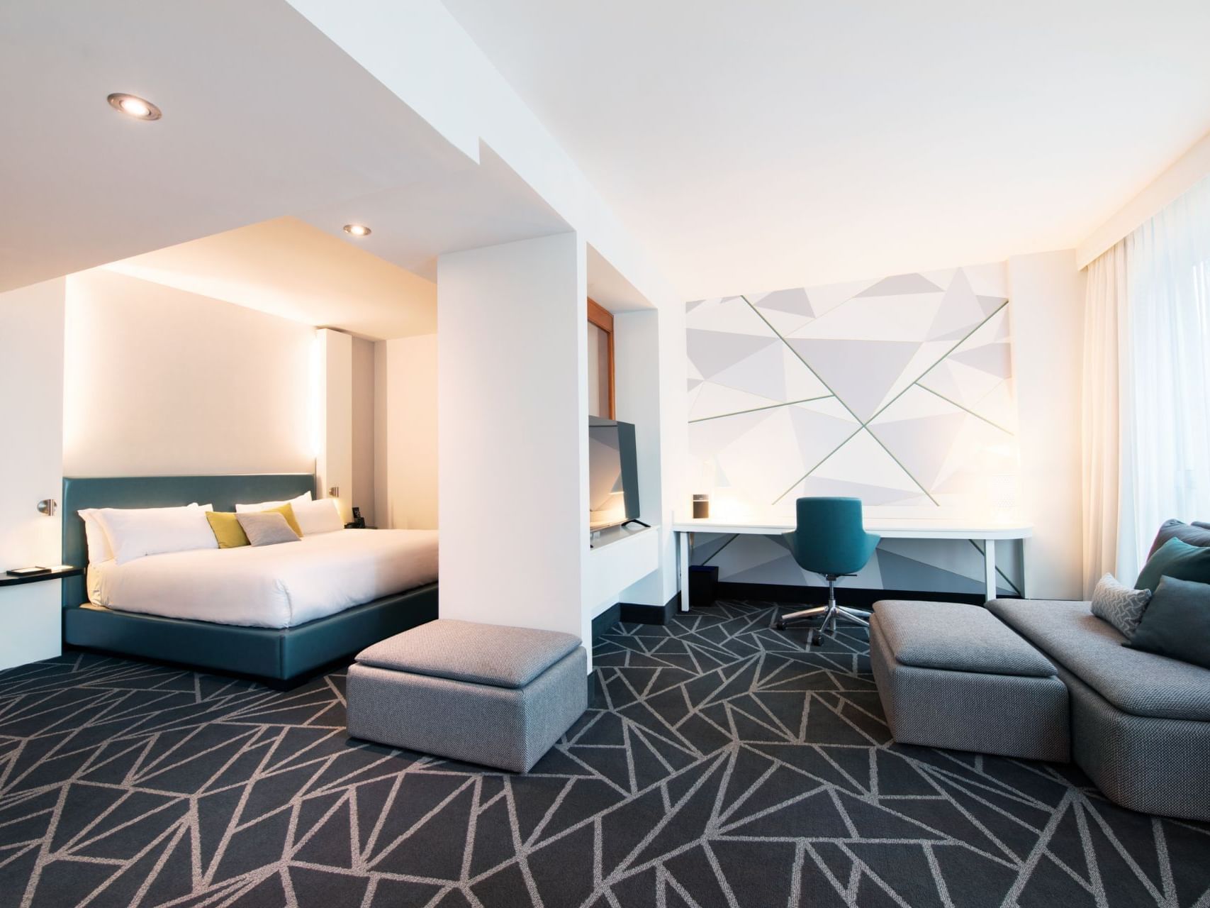 Separated bedroom and work area in Premium loft Suite at Warwick Le Crystal