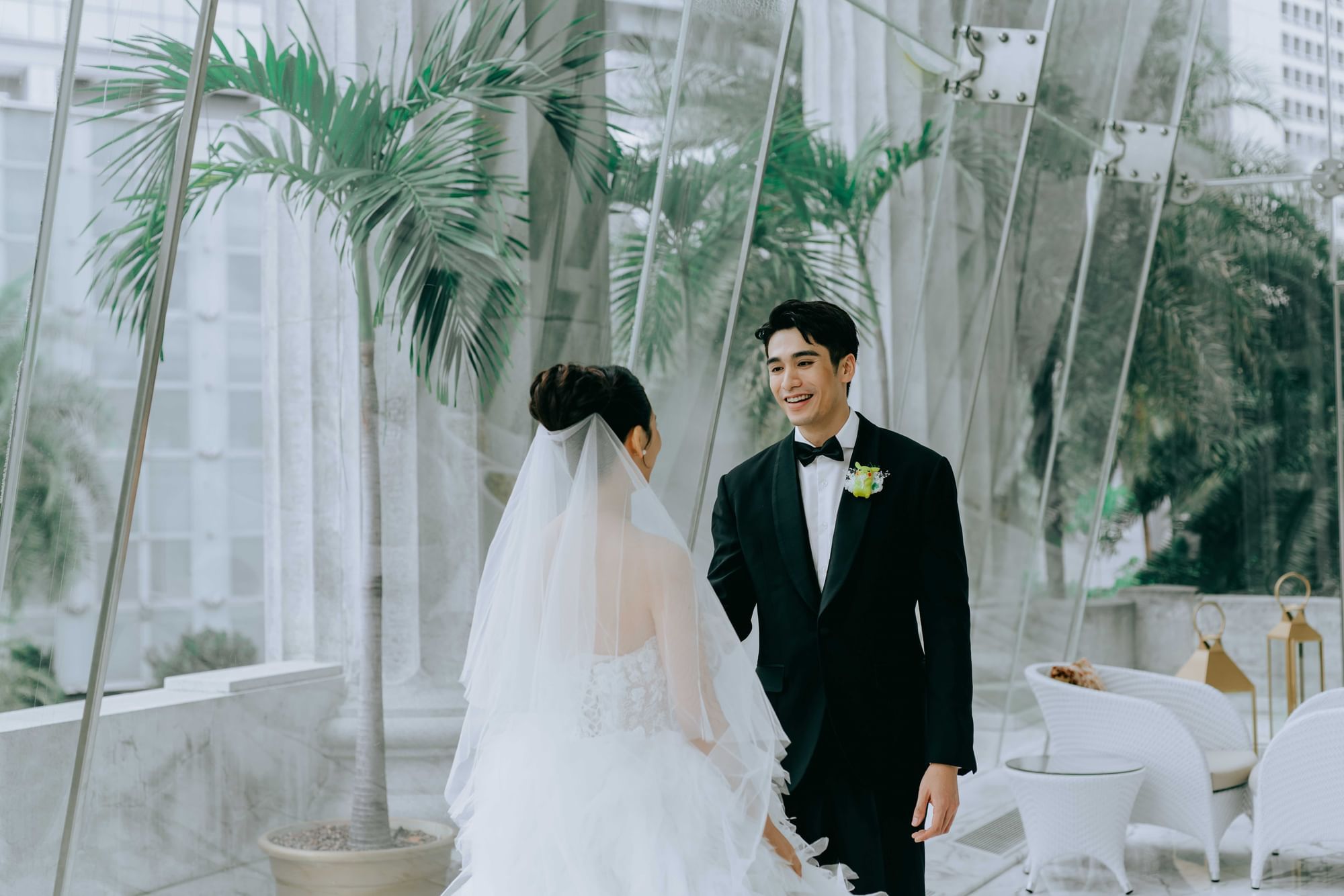 Bride and Groom posing in the lobby lounge area at The Fullerton Hotel Singapore