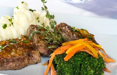 Steak served in a restaurant at Windsong Resort On The Reef