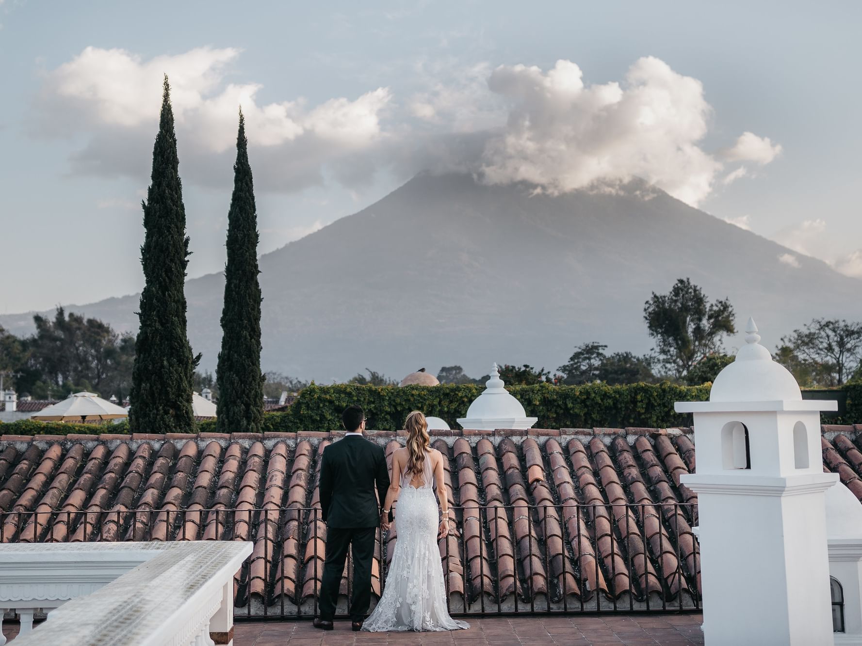 Bride & Groom overlooking the mountain from the Rooftop at Pensativo House Hotel