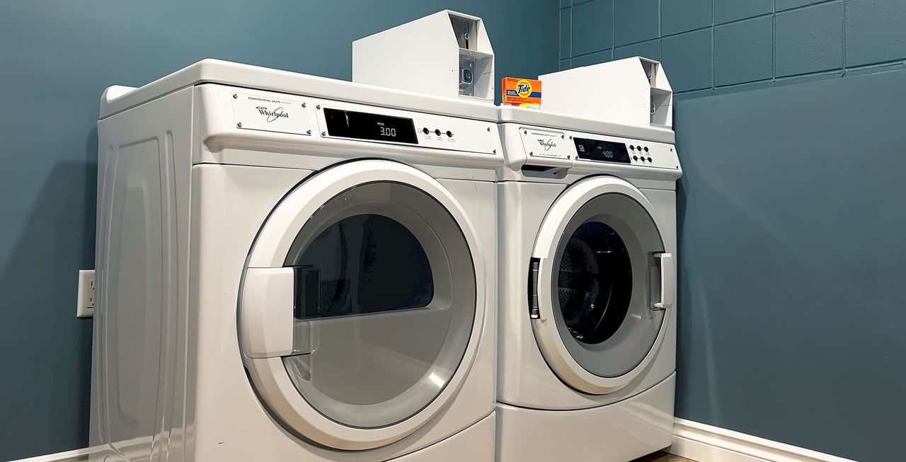 Laundry room with washing machine and sink