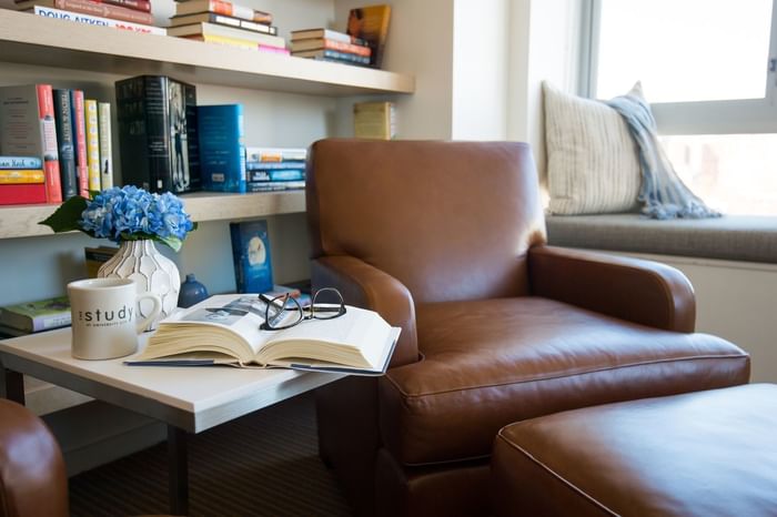 Leather chair and book on side table