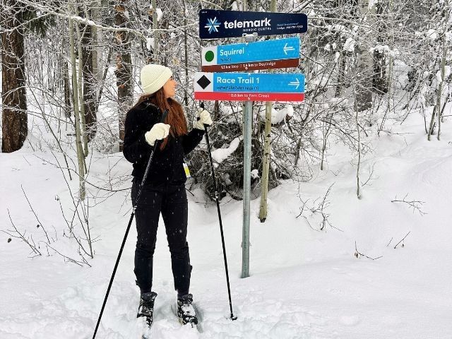 Woman cross country skiing at Telemark Nordic in West Kelowna, BC.