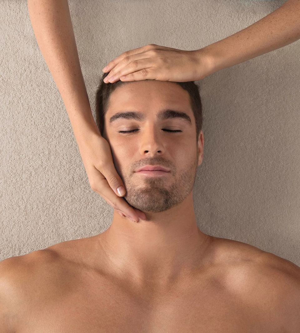 Man receives a relaxing head massage at Thalgo Spa, The Saujana Hotel Kuala Lumpur