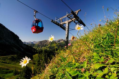 Low angle shot of a cable car near Hotel Liebes Rot Flueh