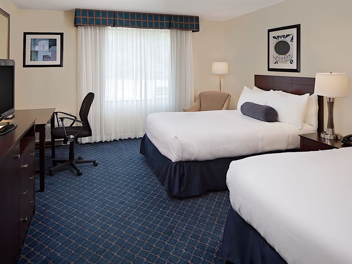 Two beds & lamps in Standard King Guestroom at Boxboro Regency