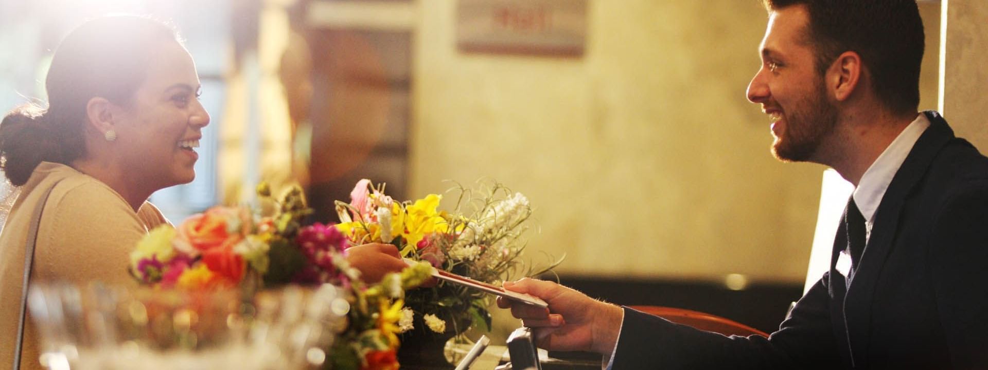 Couple next to flowers at wedding