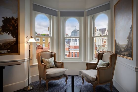 2 ancient chairs & lamp at Junior Suite at Sloane Square Hotel