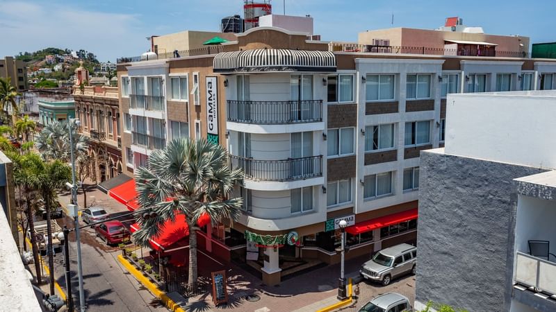 An exterior view of the hotel & street at Gamma Hotels