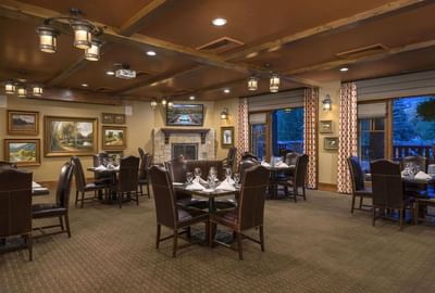 Set up banquets by the windows and wall mounted arts in Crescent Room at Hotel Park City Autograph Collection