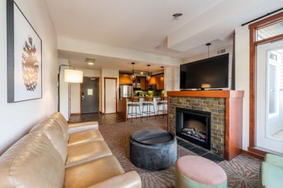 Fireplace and kitchenette by the TV lounge area in Three Bedroom Suite at Blackstone Mountain Lodge