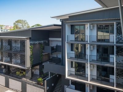 Modern multi-story student accommodation building with balconies and courtyard at UniLodge School Street Studios