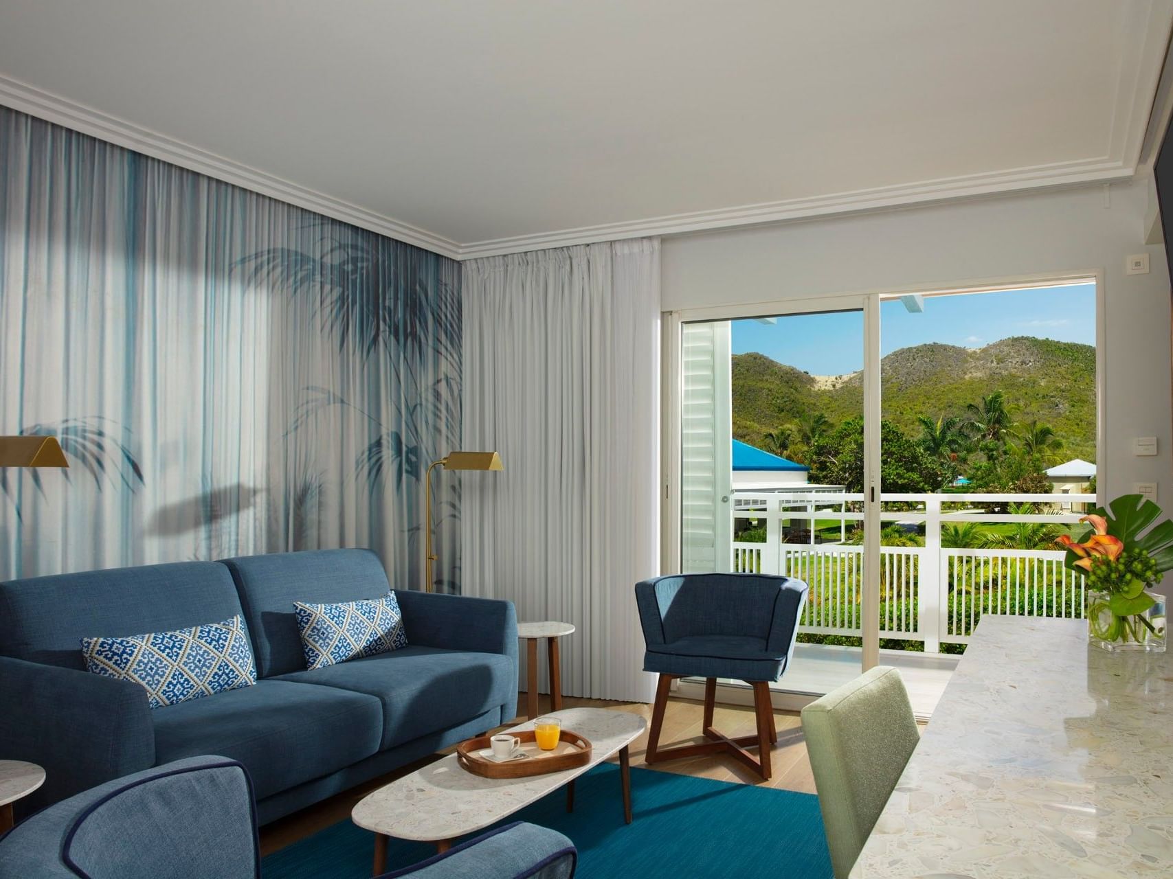 TV lounge area in Marina King Suite with swim-out pool access at St. Martin Beach Resort, one of the best St. Martin resorts