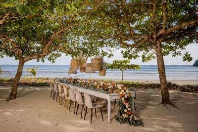 A dining & lounge area with a beach view at Punta Islita Hotel