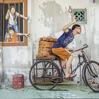 A penang mural of brother and sister who wants bao
