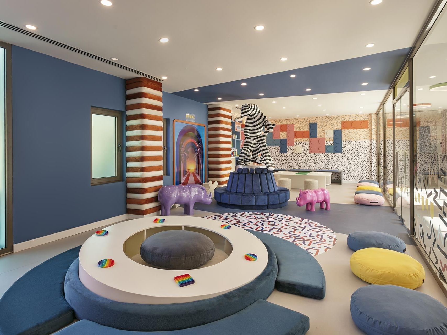 Upupa Kids Club with circular seating and whimsical animal sculptures at Cullinan Belek