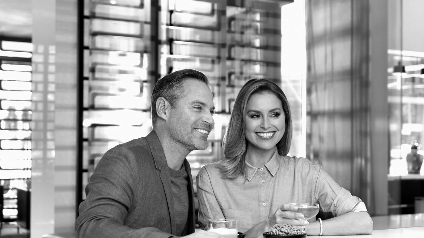 A couple dining in a restaurant at Crown Hotels