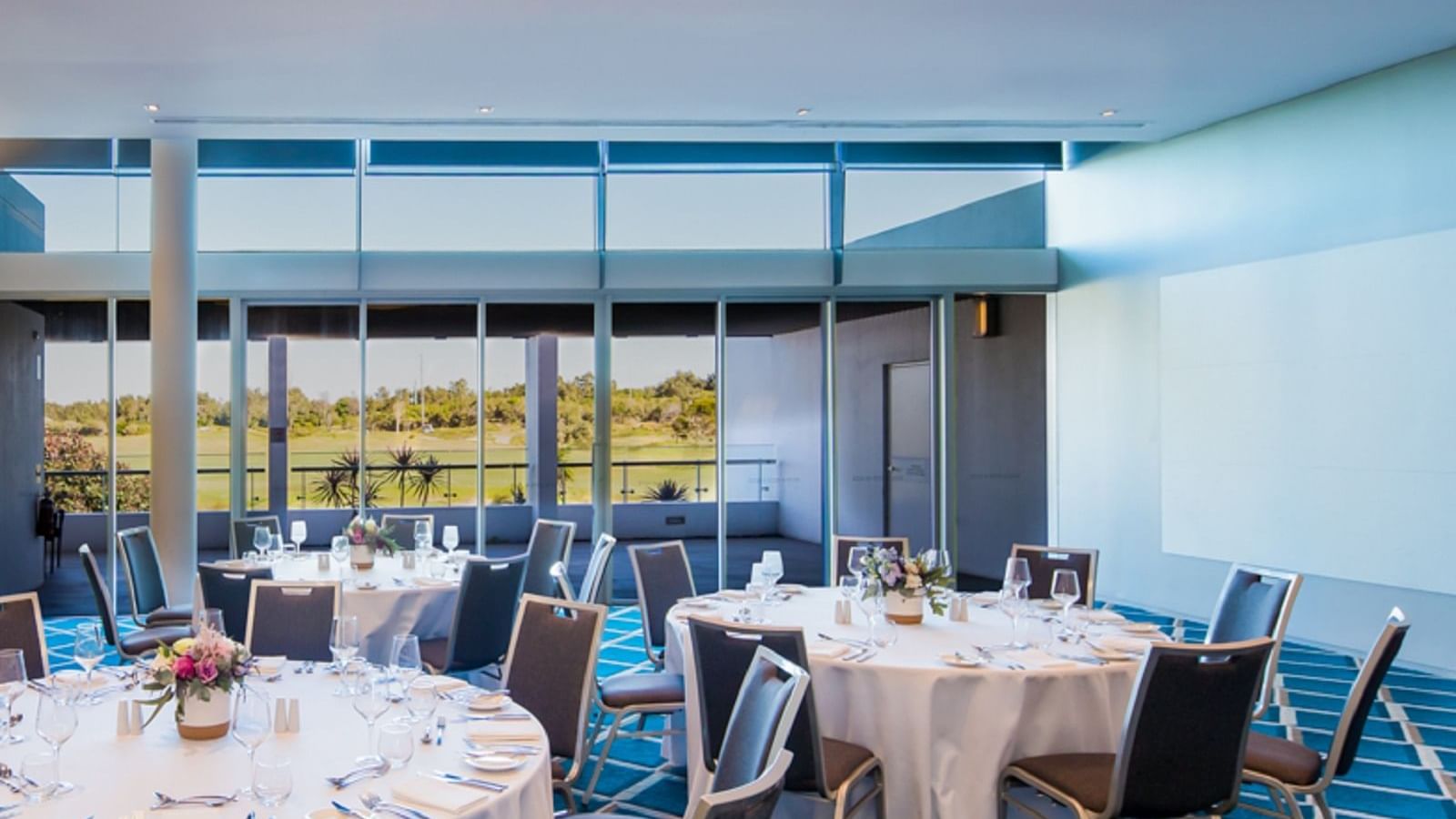 Round tables in event rooms at Pullman Magenta shores