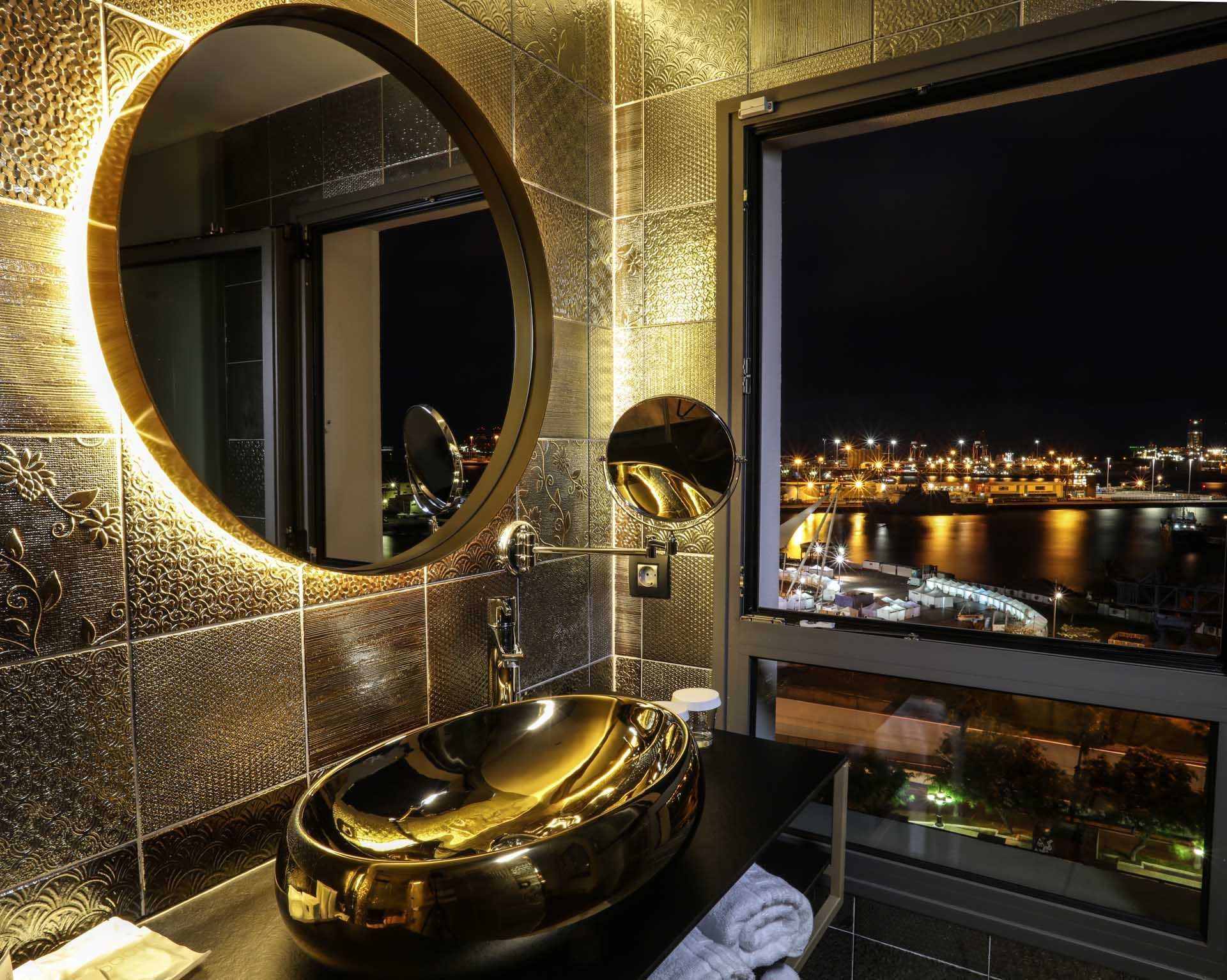 Bathroom in a room with a sea view at Design Plus Group Hotels