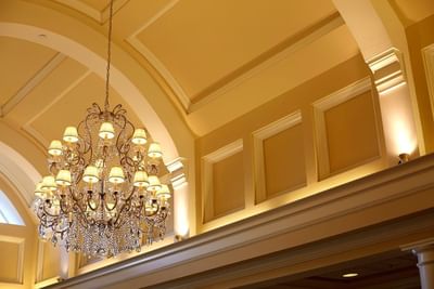 Close-up of chandelier on the lobby ceiling at Trianon Bonita Bay