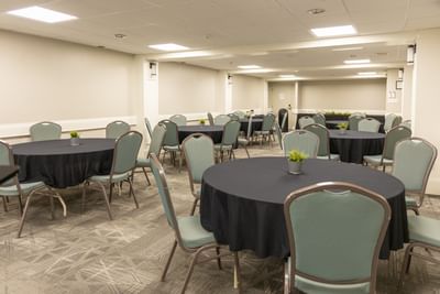 Spacious banquet or conference hall room setup with round tables at Rodd Moncton, a top event space in Moncton