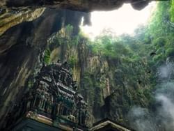 Low-angle view of Batu Caves near St Giles Boulevard