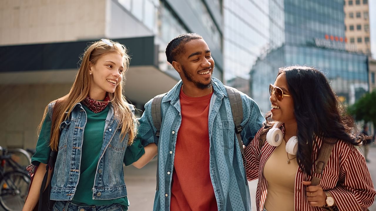 a group of friends walking on a city street
