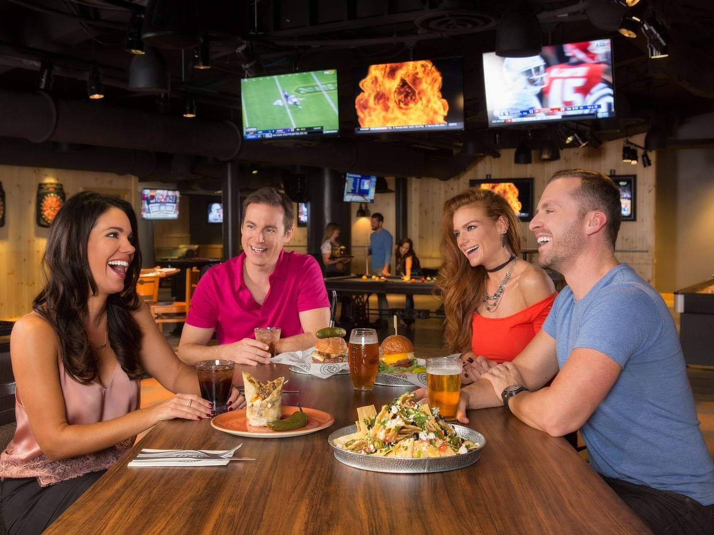two couples sharing appetizers