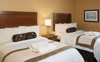 Nightstand by the beds in Standard Two Doubles at Temple Gardens Hotel & Spa