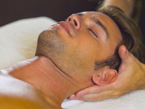 man getting head massaged