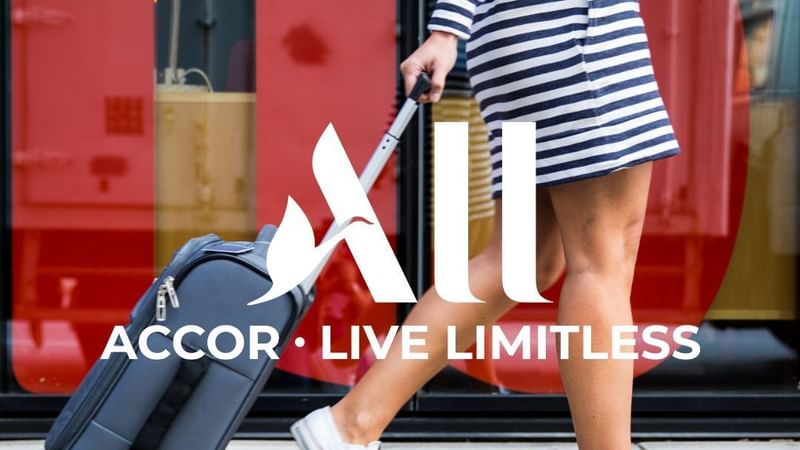 Poster for Accor Live Limitless, showing a traveler with luggage used at Ibis Adelaide