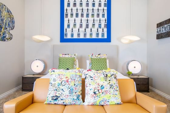 King bed, comfy sofa, bedside cupboards with lamps in King Premiere Studio at Retro Suites Hotel