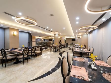 Elegant dining area in Al Meer Restaurant at Warwick Riyadh