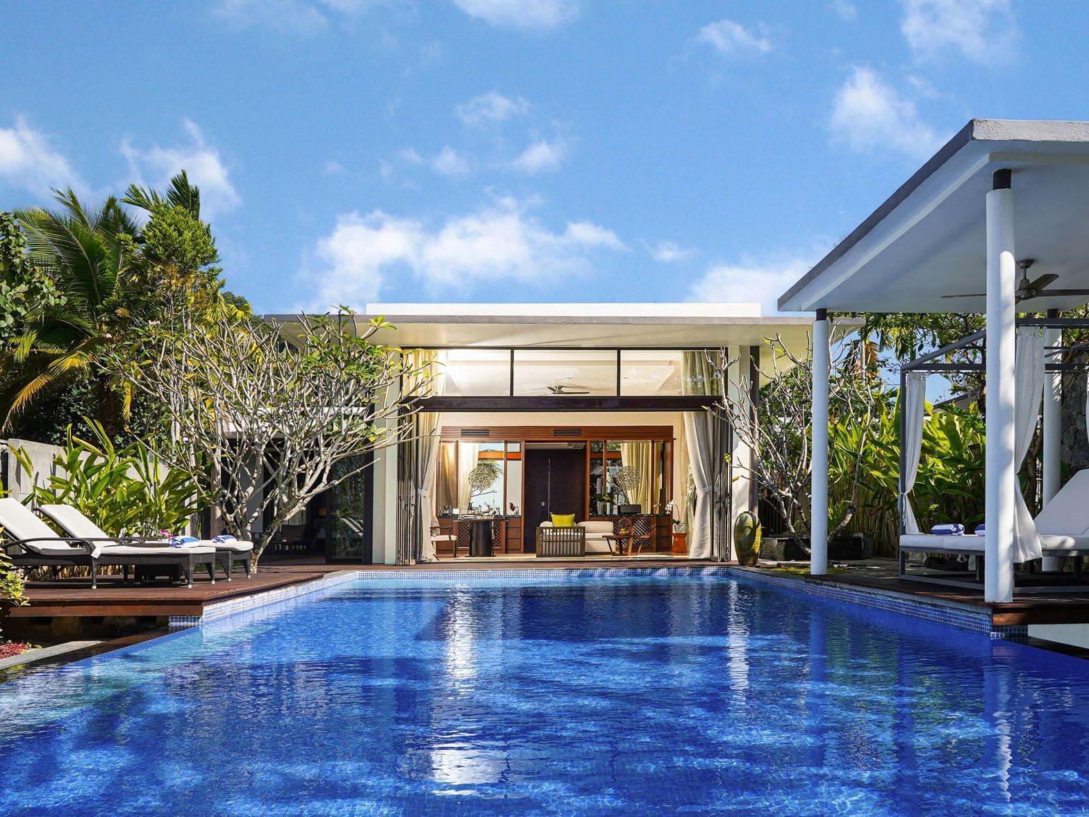 Cabanas & sunbeds by the outdoor pool in Princess Beach Villa at Danna Langkawi Hotel