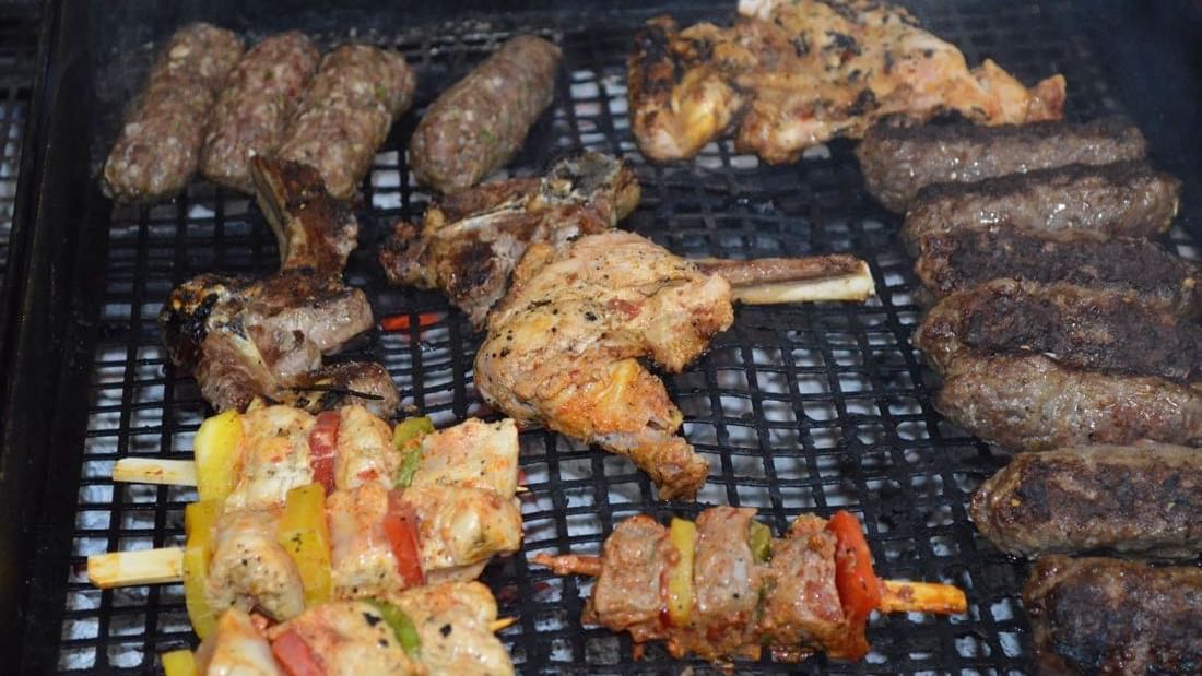 Close-up of the grill with assorted meat on BBQ night at Warwick Doha