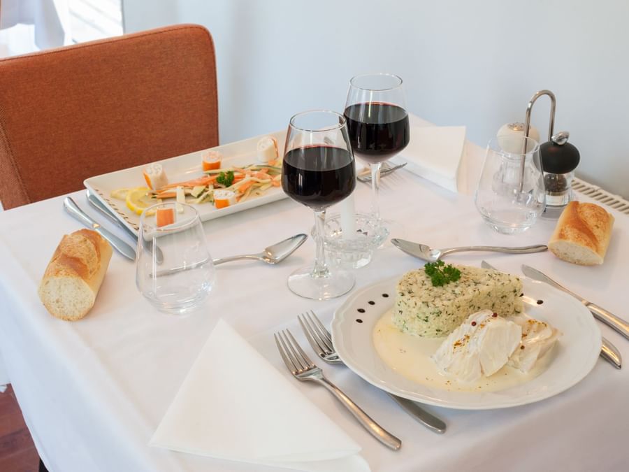 Closeup of Meals served with wine at Hotel La Cour Carree