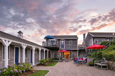 Exterior of the hotel complex, reception office, and garden at Chatham Tides Resort
